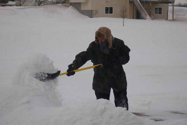 tx boy shoveling snow